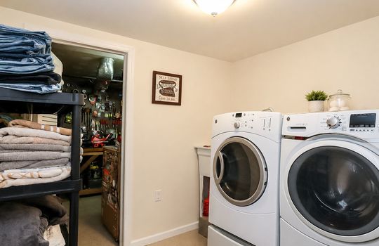 Modern laundry room with workshop view