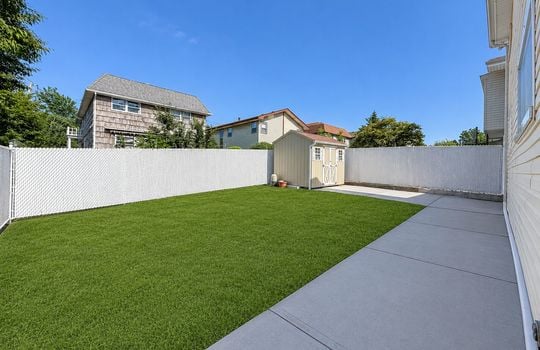 Sunny suburban backyard with shed