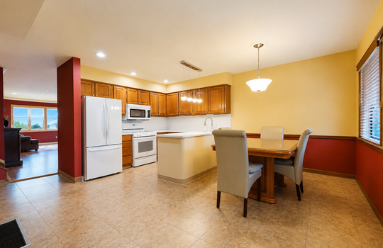 Updated kitchen with wood cabinetry and stainless steel appliances in Grasmere condo
