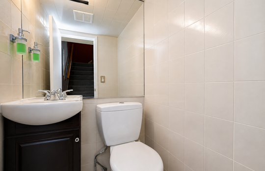 Updated half bathroom with modern vanity in Grasmere condo