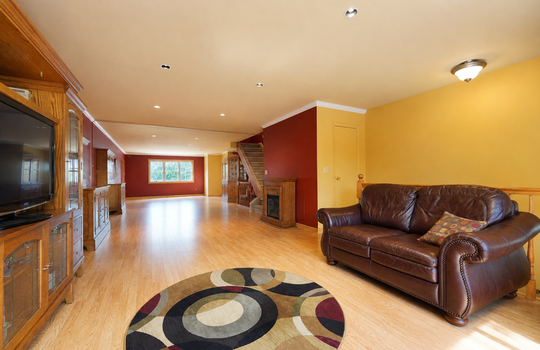 Spacious living room with hardwood floors and natural light in Grasmere condo