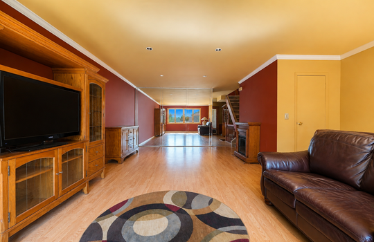 Spacious living room with hardwood floors and natural light in Grasmere condo