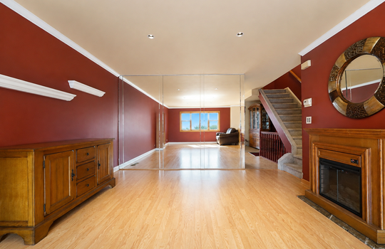 Spacious living room with hardwood floors and natural light in Grasmere condo