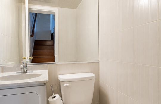 Updated half bathroom with modern vanity in Grasmere condo