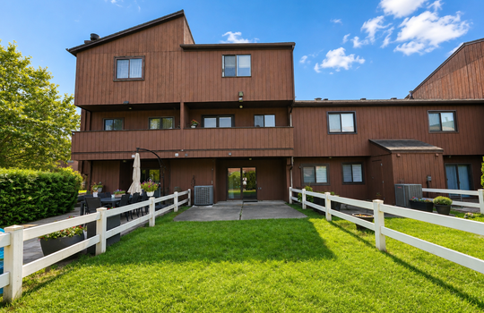 Open lawn and patio area behind Stonegate condo in Grasmere Staten Island