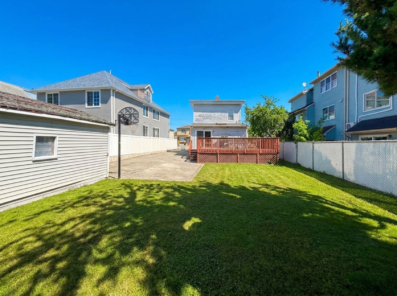 Grassy backyard at 34 Church Avenue in Travis, Staten Island.