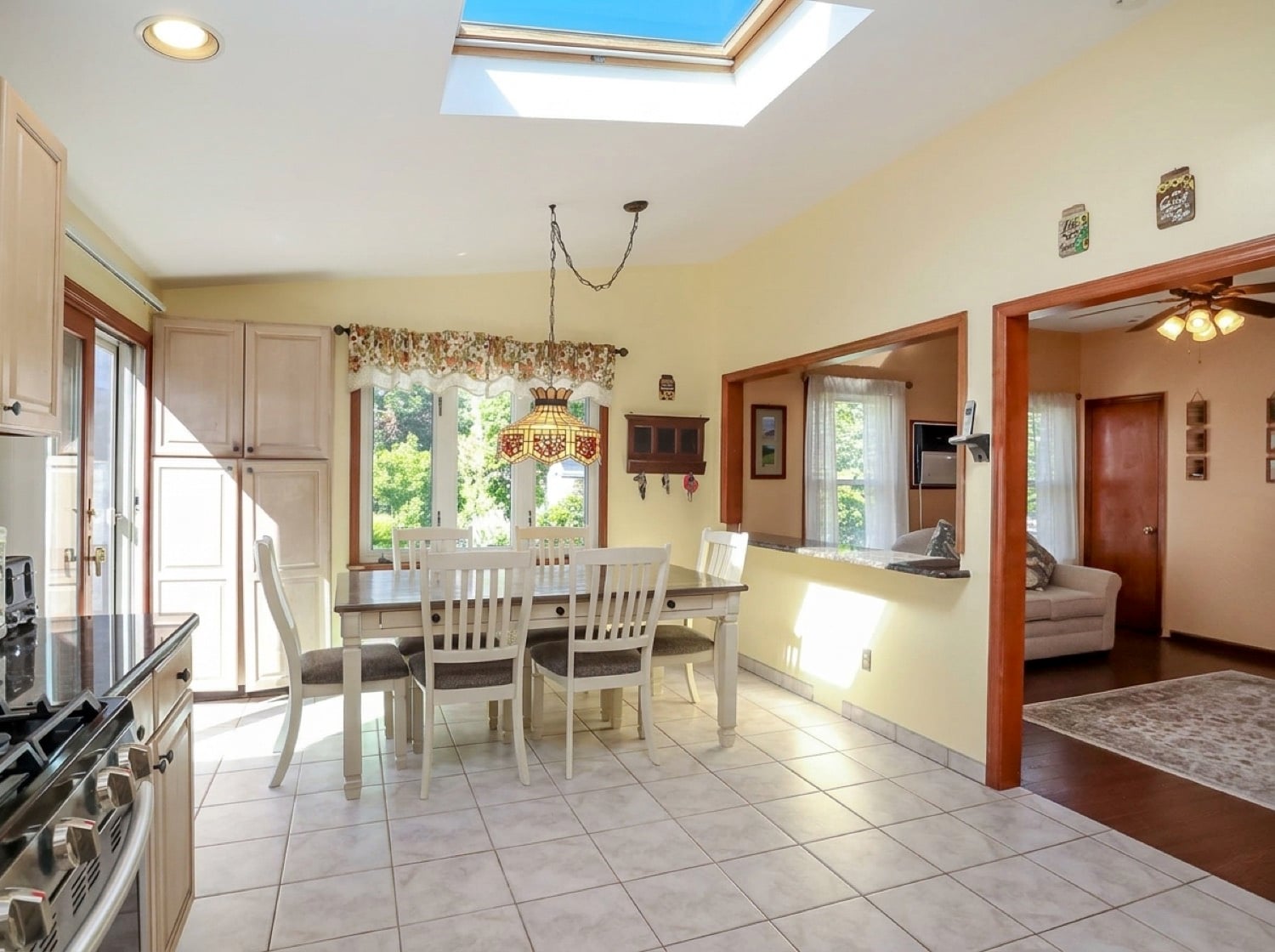Eat-in kitchen at 34 Church Avenue with a dining area and sliding glass doors to the deck.