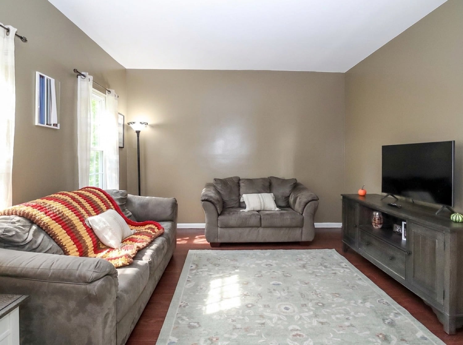 Living room at 34 Church Avenue looking toward the entry foyer and staircase.