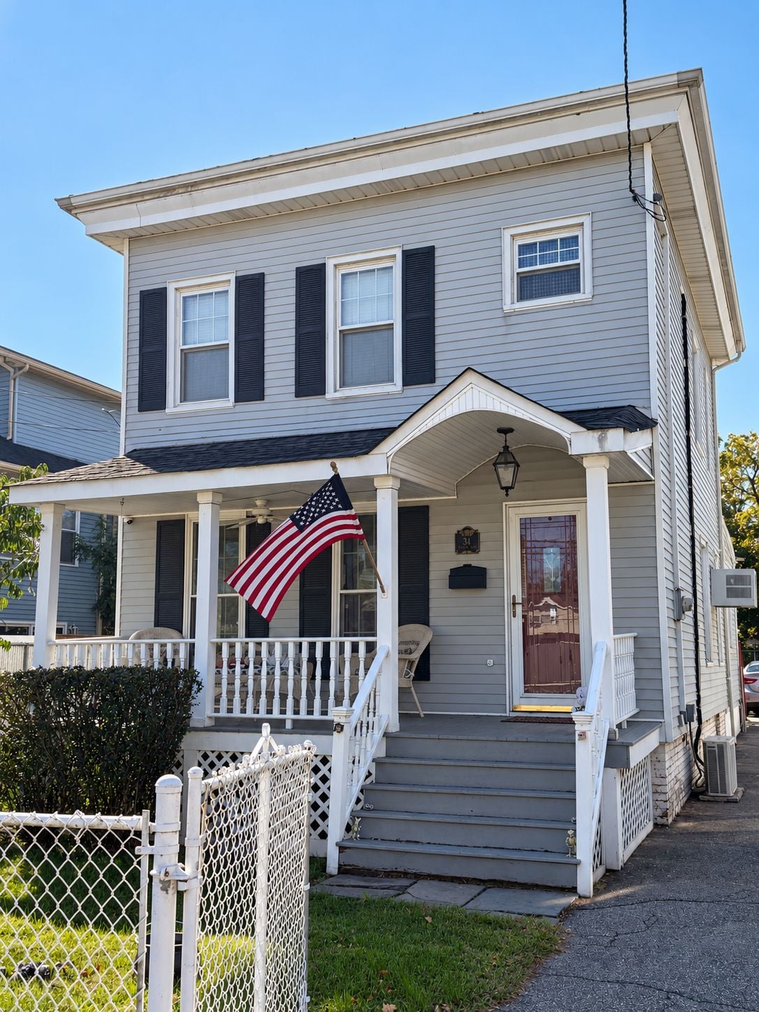 Detached Colonial at 34 Church Avenue in Travis, Staten Island, with a covered front porch.