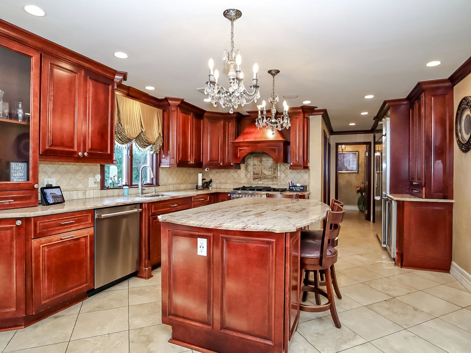 Gourmet kitchen at 34 Fayann Lane with mahogany cabinetry, granite countertops and premium appliances