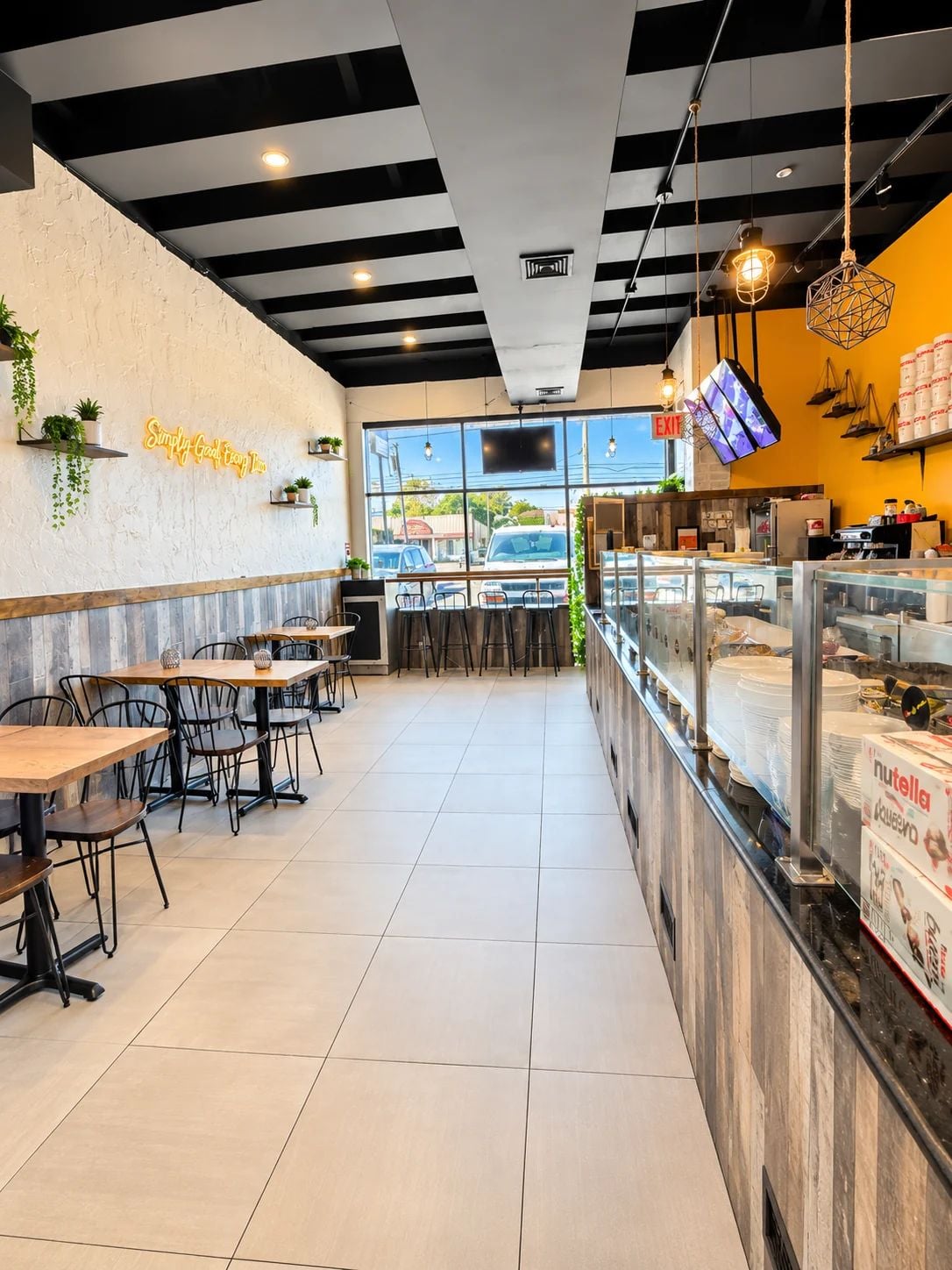 Interior of Crepe Stop cafe in New Dorp Staten Island featuring seating and service counter