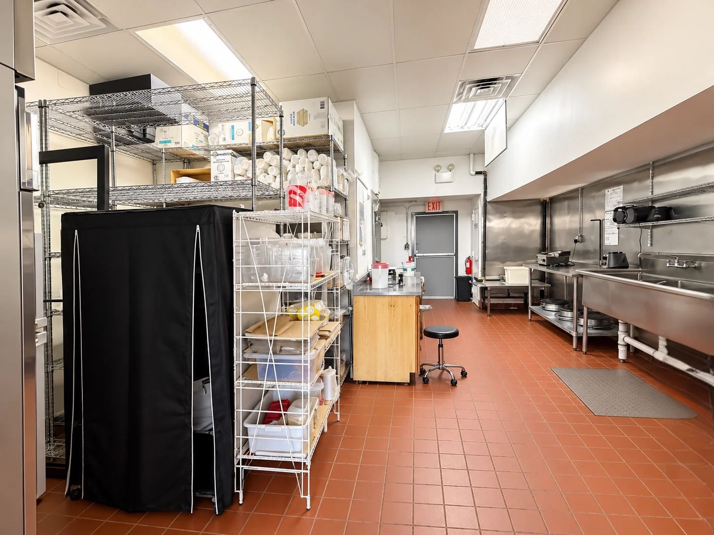 Rear commercial kitchen and storage area at Crepe Stop in Staten Island