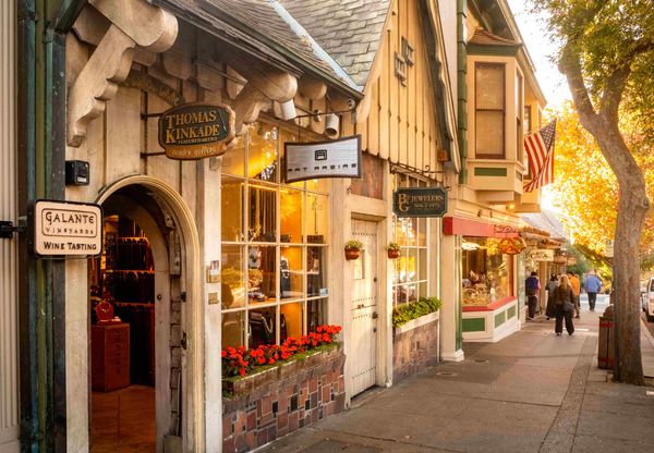 Shops and cottages on a tree-lined street in Carmel-by-the-Sea