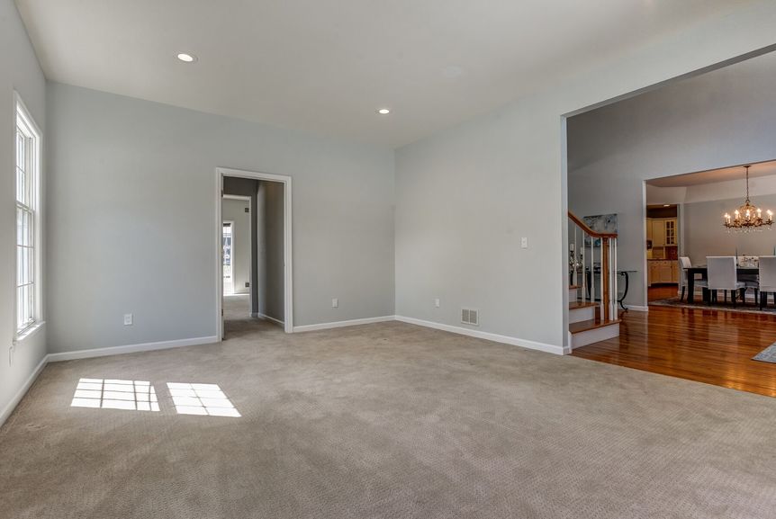 Living room with foyer and office