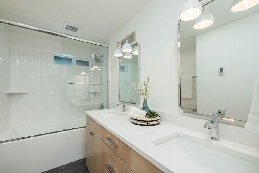 Newly updated guest bathroom with contemporary finishes and shower in remodeled home for open house in Valhalla Heights, Bend, Oregon