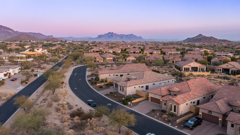Modern Mesa neighborhood street with desert plants and mountain views