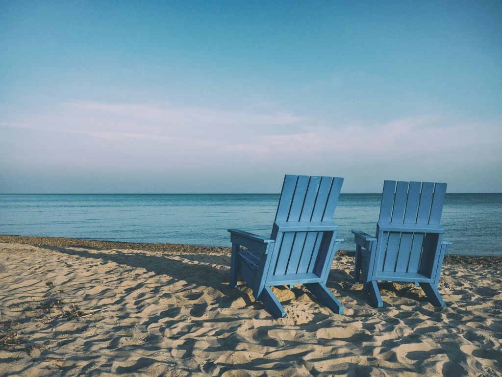 Deckchairs pairs in the sand