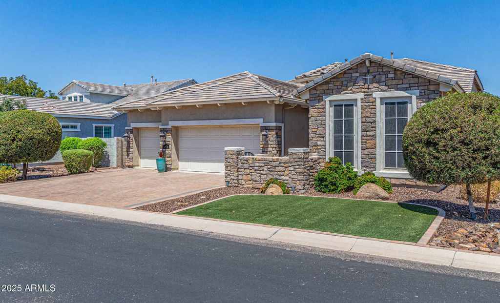 Modern single-story Mesa home with desert landscaping under a clear blue sky