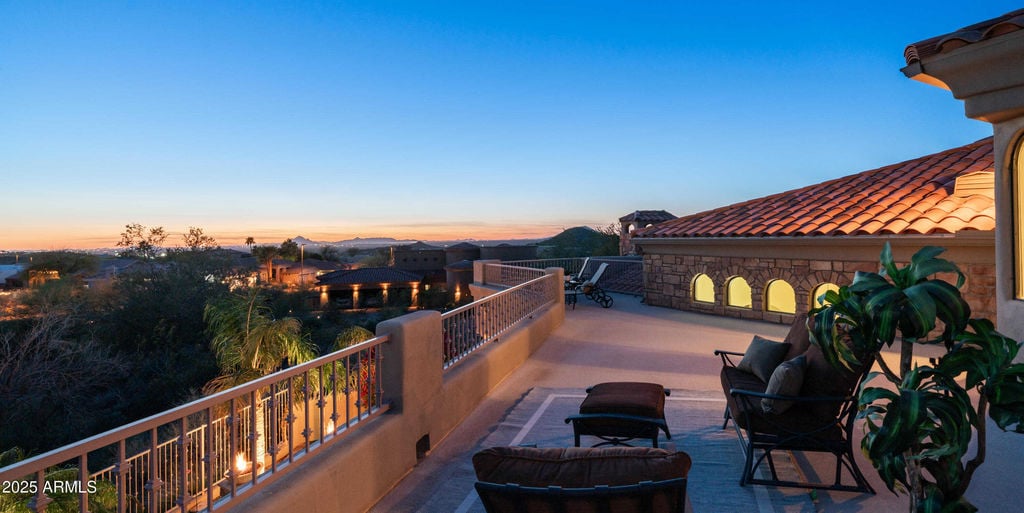 “Luxury Mesa estate at twilight — panoramic exterior of 4332 N Santiago Circle with glowing pool and mountain backdrop.”