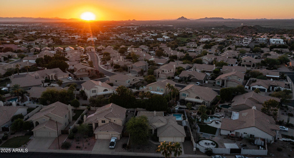 Aerial view of luxury homes in Las Sendas surrounded by desert scenery.