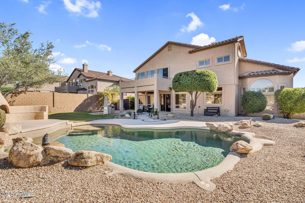 Backyard pool with mountain and sunset views