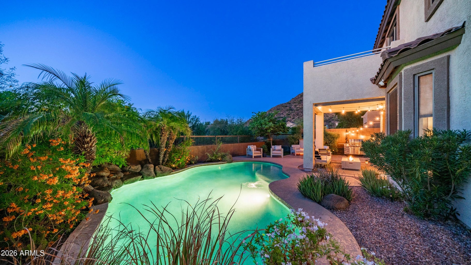 Private pool and mountain sunset views illustrating luxury outdoor living in Las Sendas Mesa AZ near Red Mountain