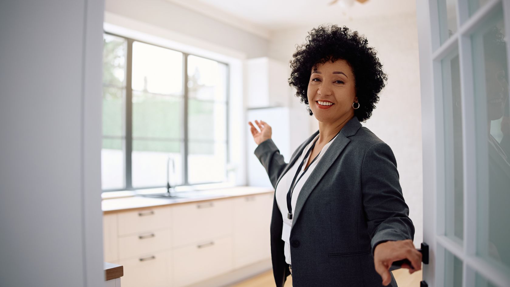 Photo: An Agent Opening A Door to an Open House