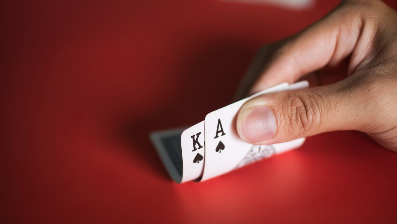 Photo: A Hand with Poker Cards