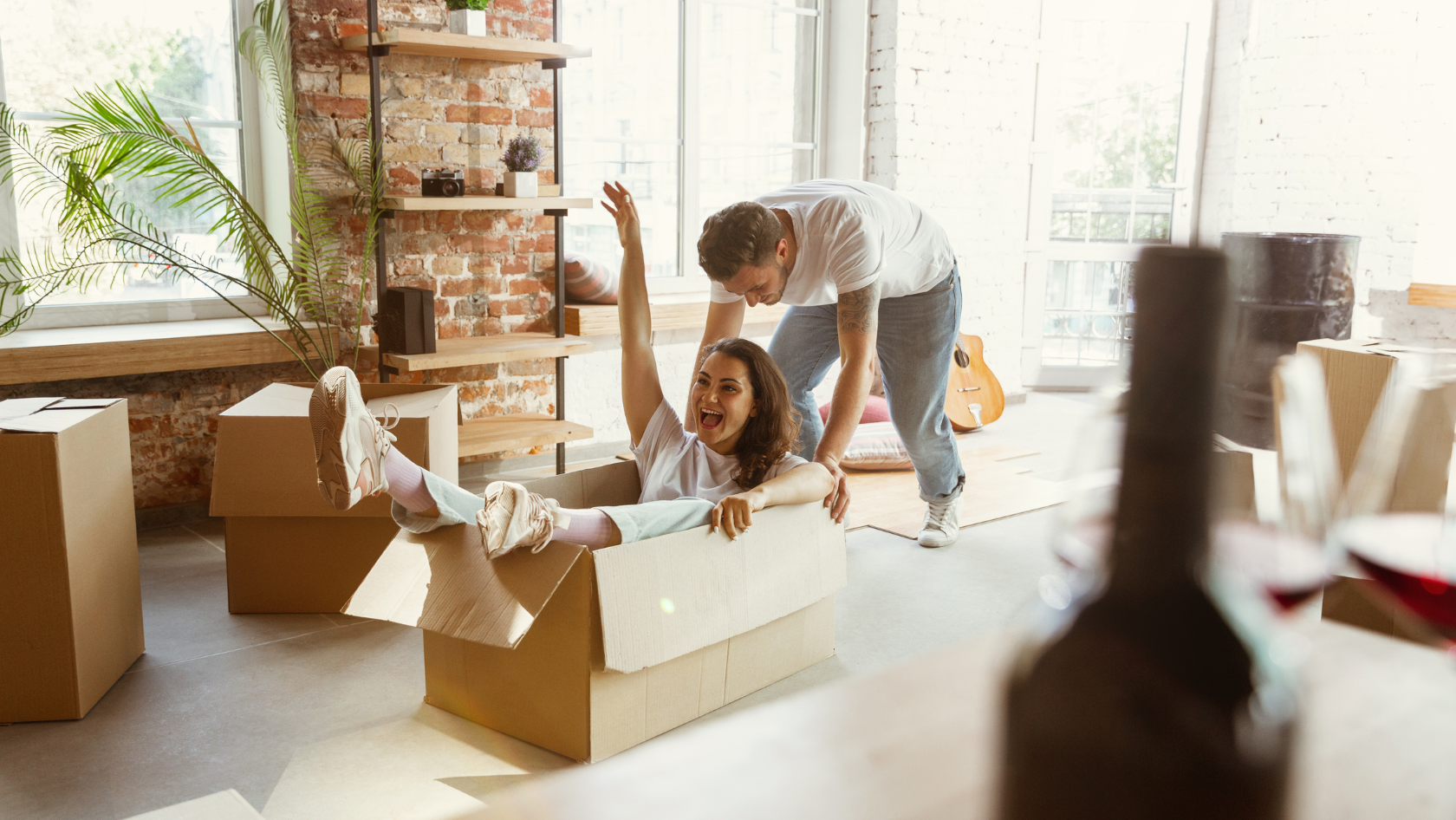 Photo: A couple playing with a box