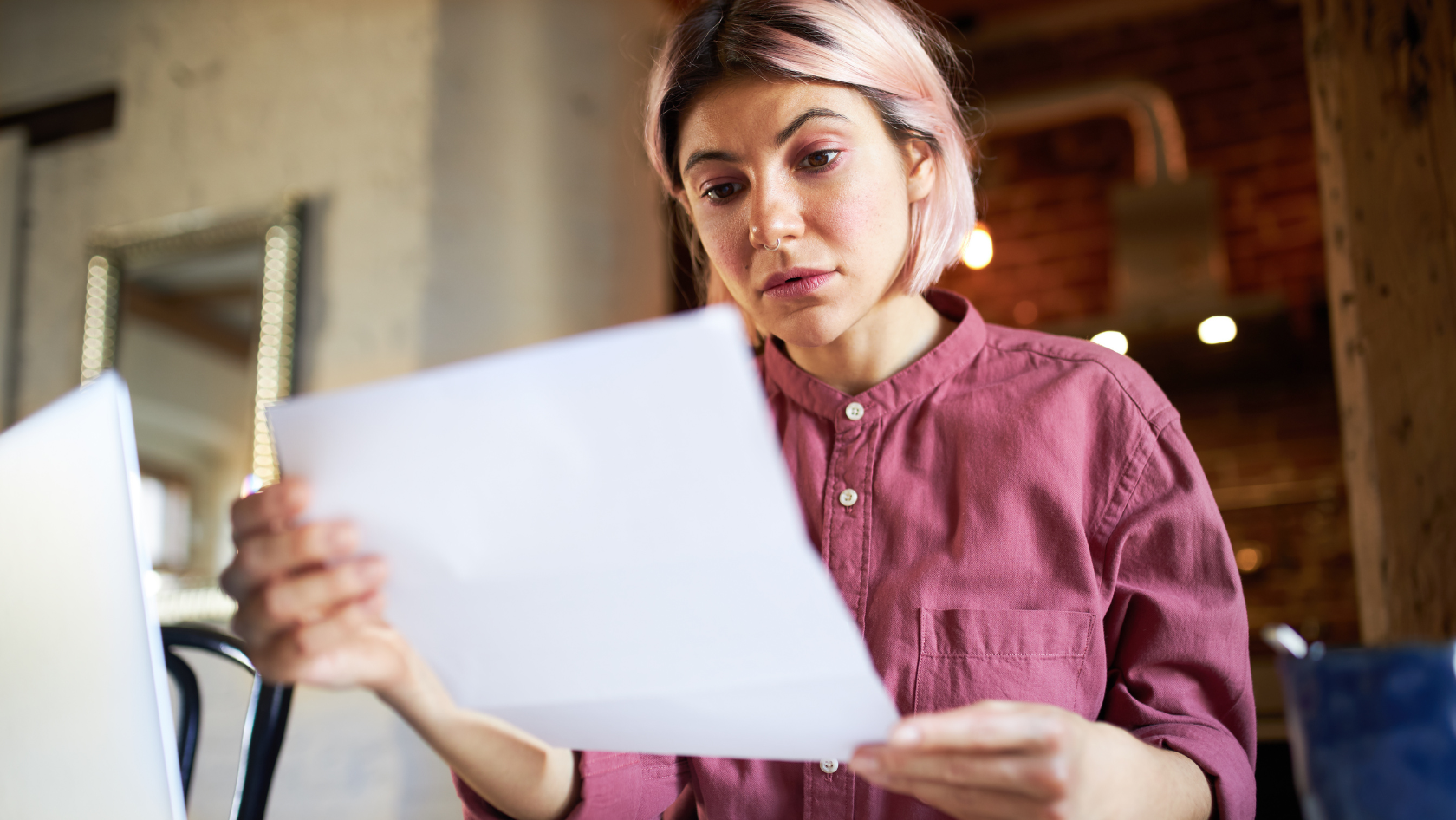 Photo: A Woman checking Bills