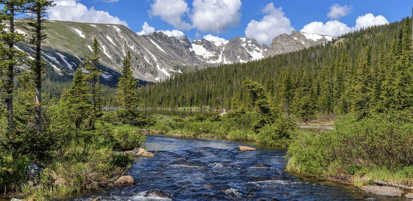 Spring Mountain Creek – South Saint Vrain Creek at Long Lake, with Indian Peaks towering in background, on a sunny Spring morning in Indian Peaks Wilderness.
