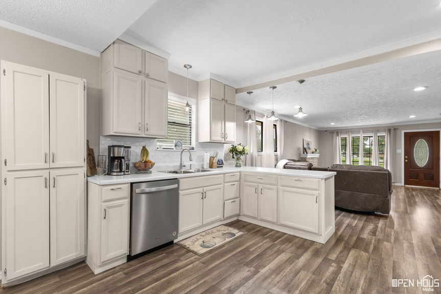 Open plan view showing the kitchen and living room in a modern home setup.