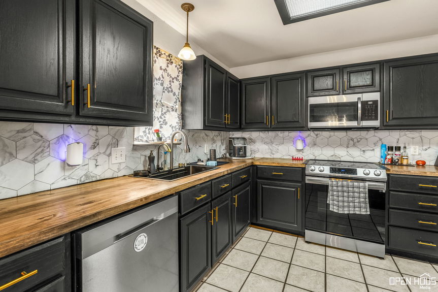 Kitchen with stainless steel appliances.