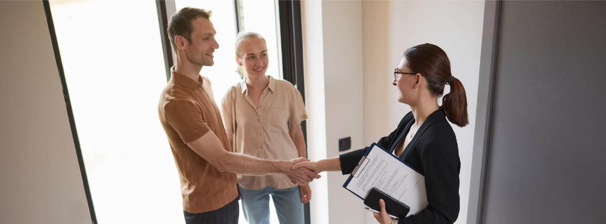 Hands with contract and pen at a negotiation table