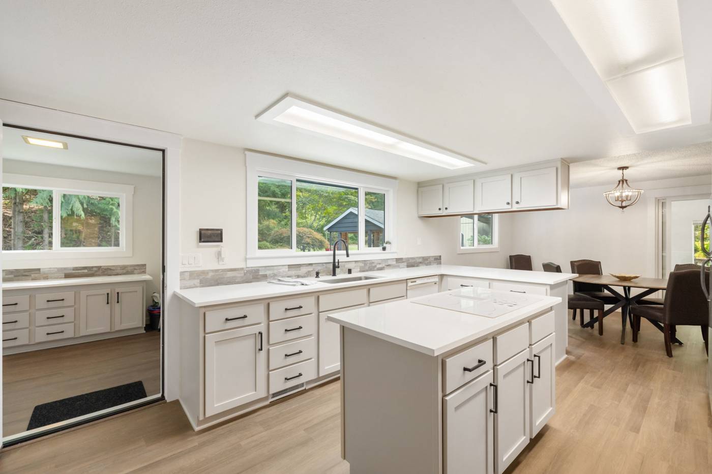 Remodeled kitchen with island and quartz counters