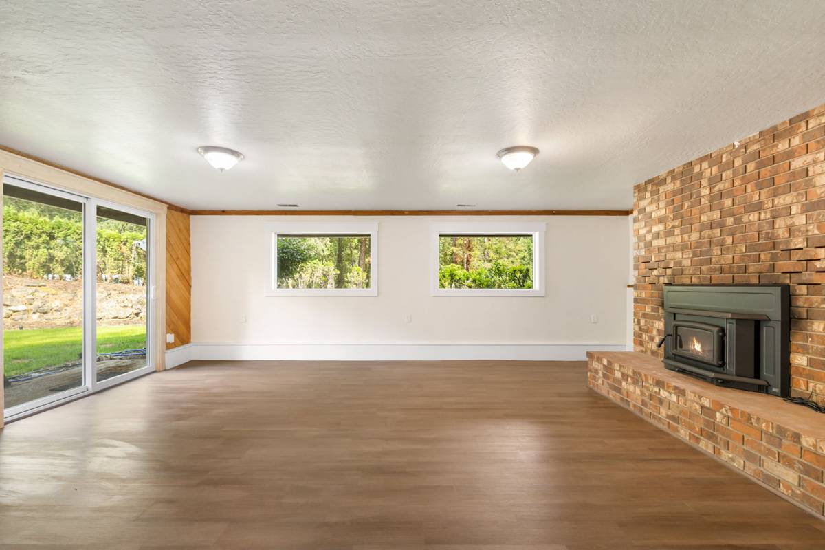 Lower level family room with brick fireplace