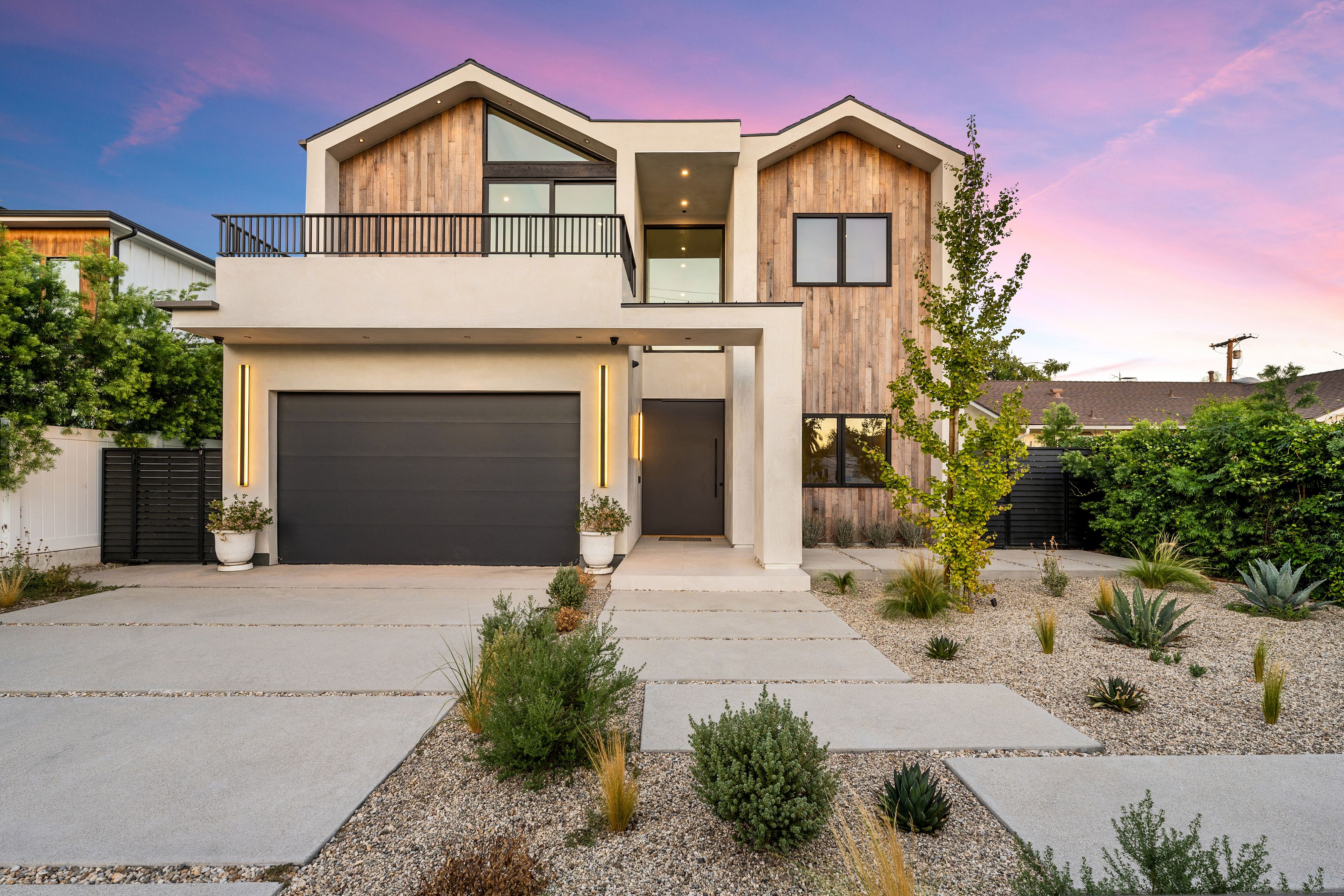 Modern house with wooden facade at sunset