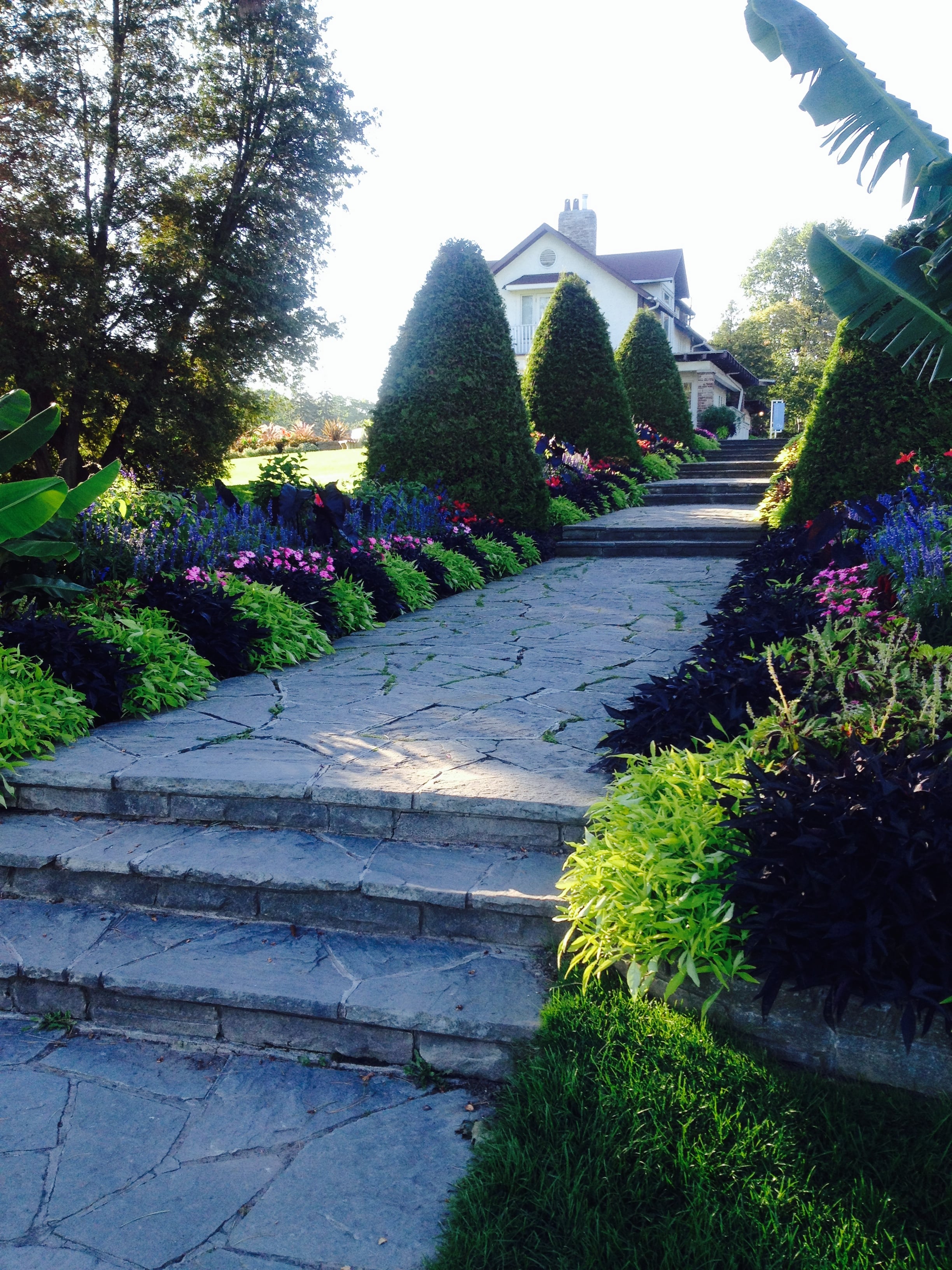 Garden paths and the heritage house at Gairloch Gardens in Eastlake, Oakville
