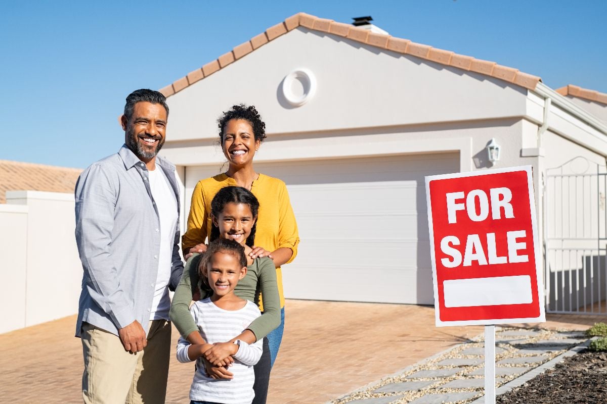 happy-mixed-race-family-standing-outside-home-with-2025-10-11-07-39-24-utc