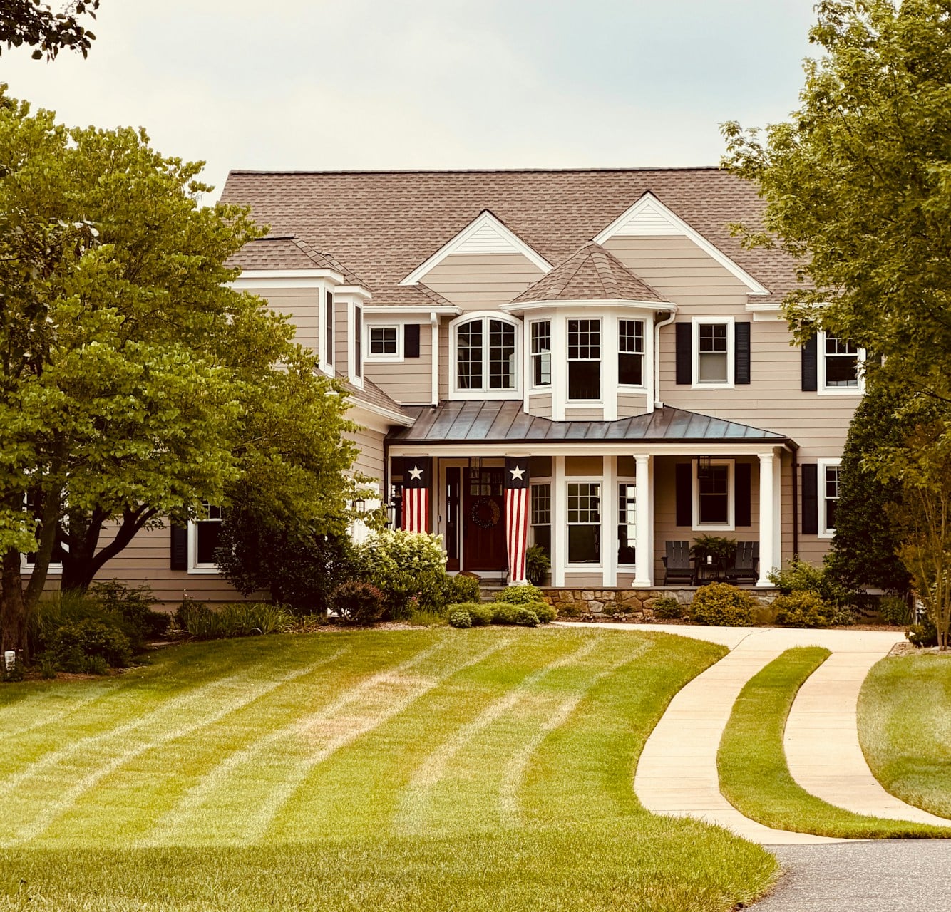 Spacious two-story move-up home with covered front porch and manicured lawn in Pittsburgh's North Hills