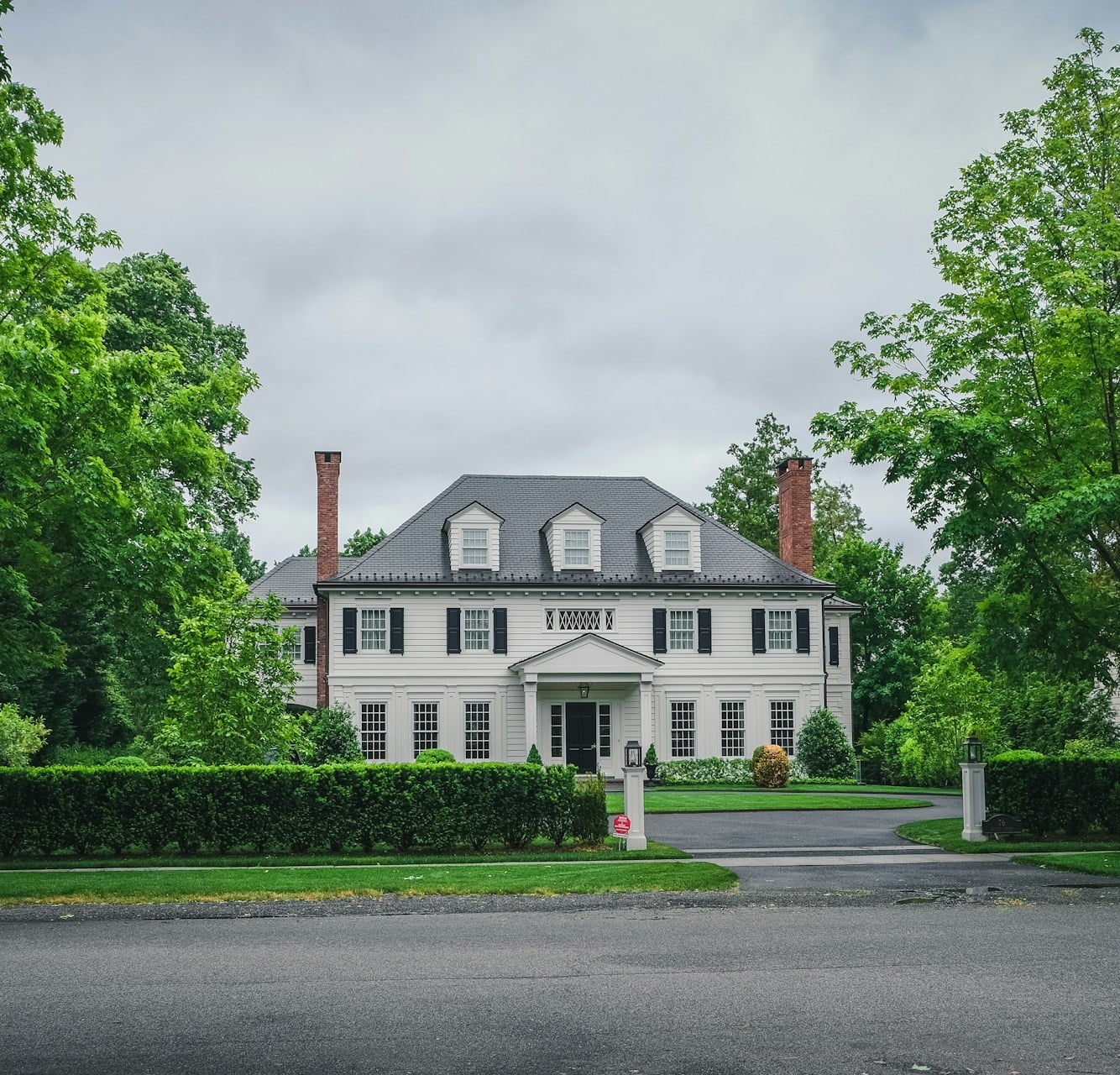 Stately white colonial estate home representing the North Pittsburgh luxury real estate market, mid-2026