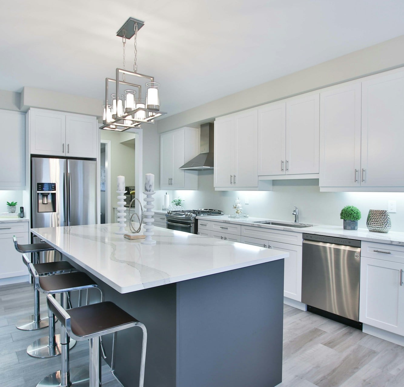 Bright white kitchen with a gray island in a North Hills PA home