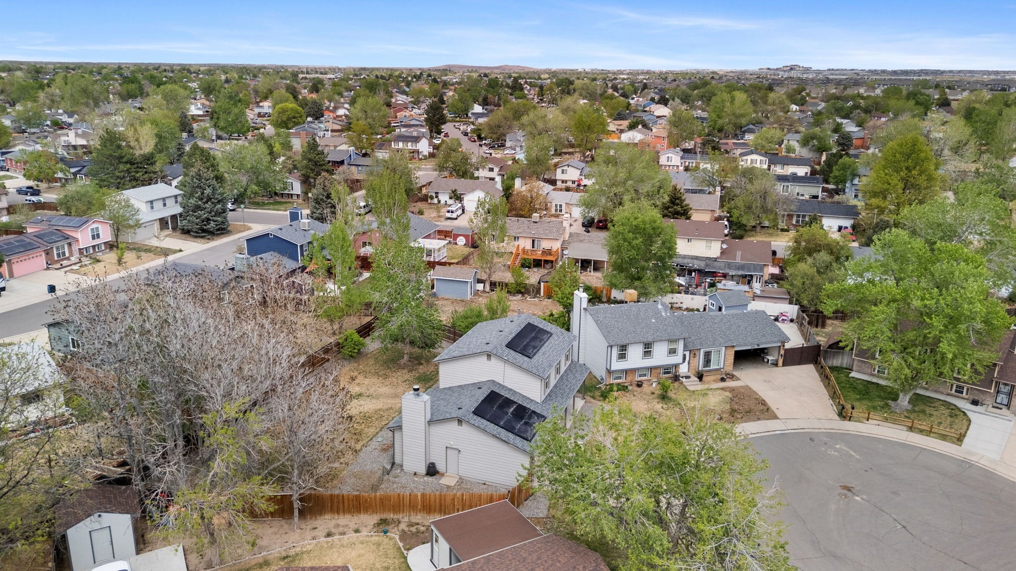 Aerial view of an established, tree-lined Denver-metro neighborhood - FORM at Compass Denver