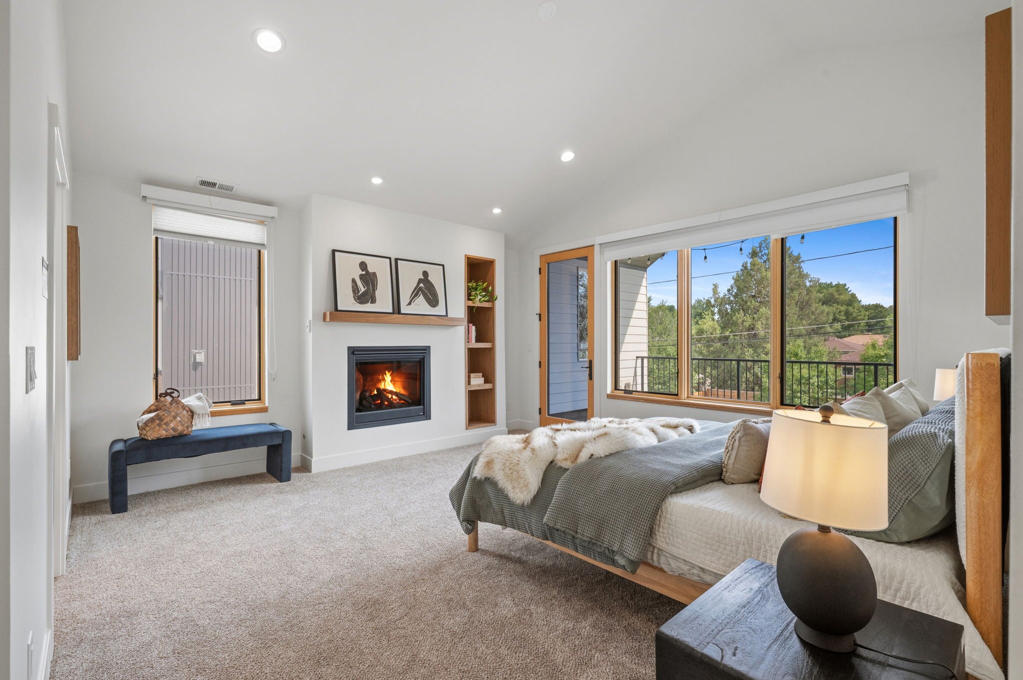 Primary suite with gas fireplace and private balcony in a Littleton CO 80120 custom home | FORM at Compass Denver