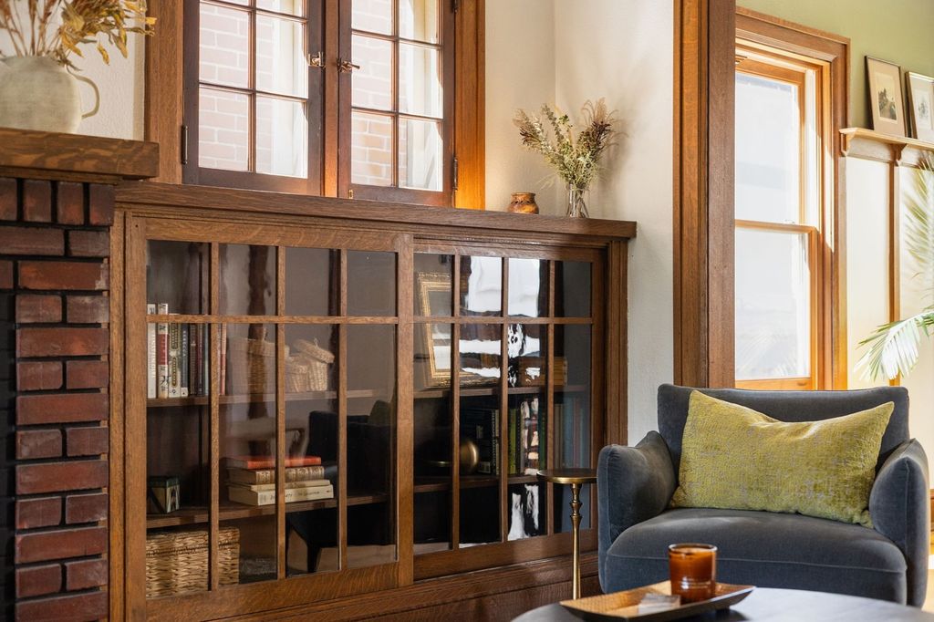 Original leaded-glass built-in bookcases and quartersawn oak woodwork in an Alamo Placita Craftsman