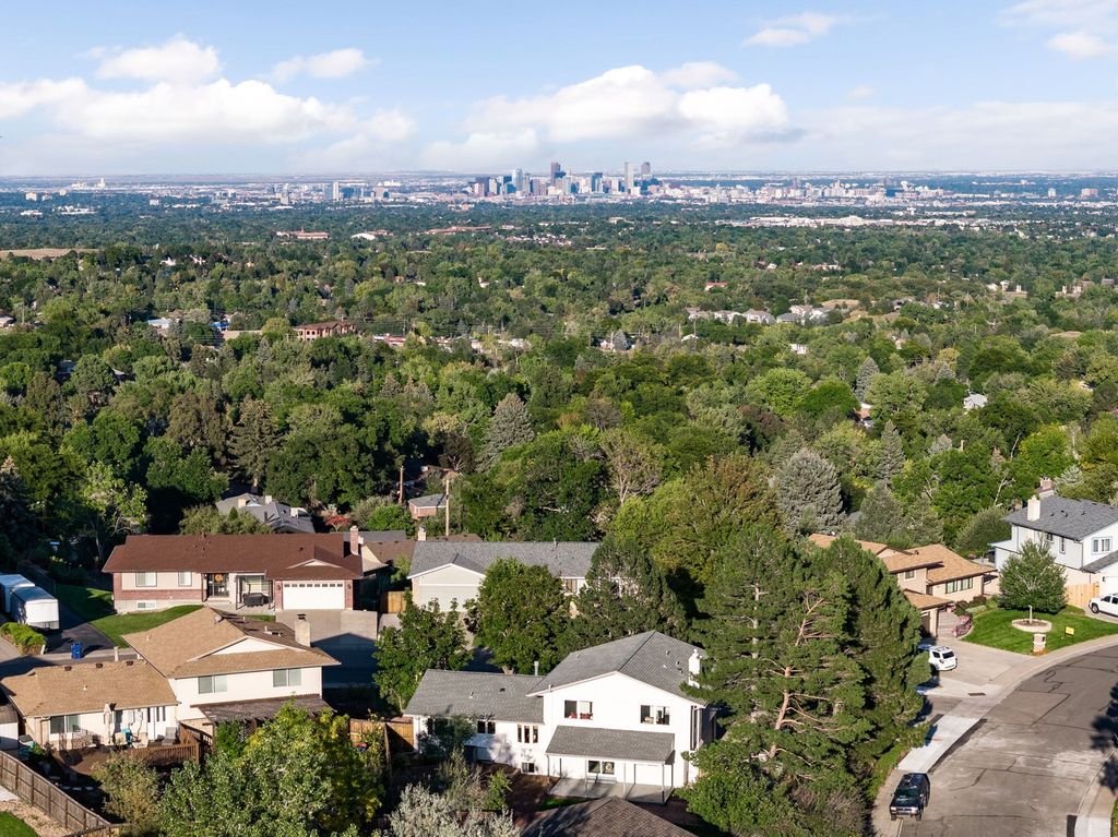 Aerial view of Applewood area homes with the Colorado foothills behind them