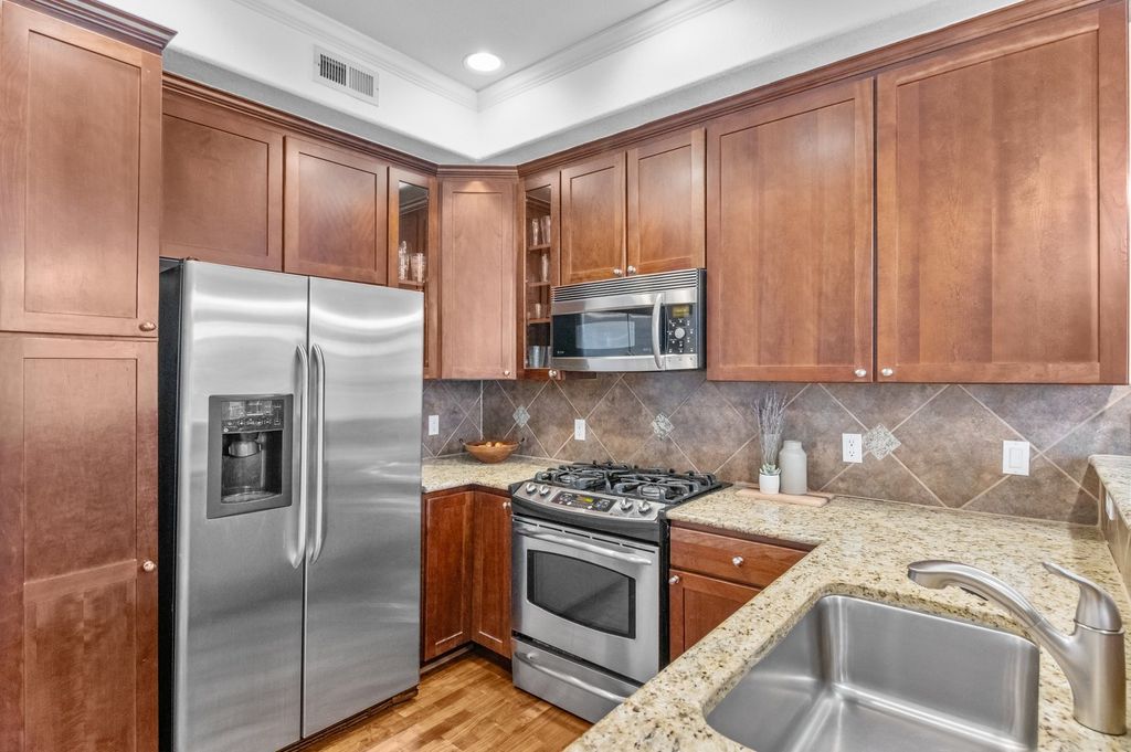 Original wood-cabinet kitchen in an older Belcaro Denver home before a pre-sale refresh