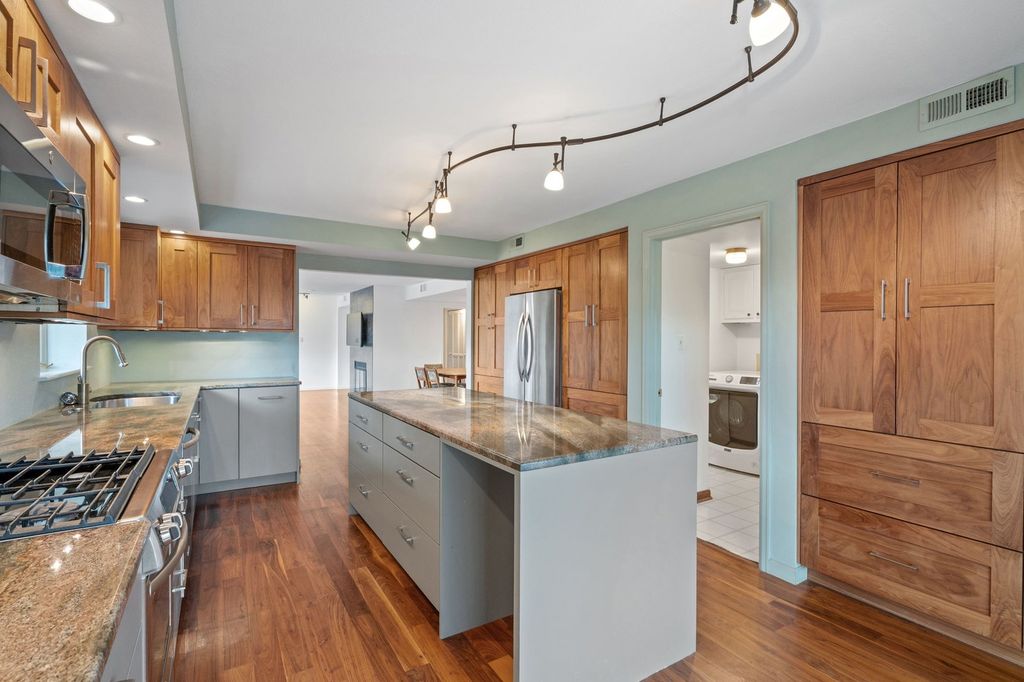 Remodeled kitchen with an island and updated finishes in a Belcaro area Denver home