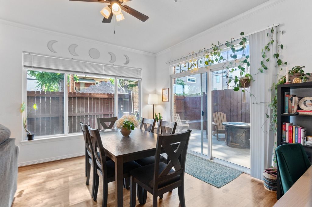 Dining room with backyard access in a central Denver home, showing the space a Bay Area buyer gains in Denver