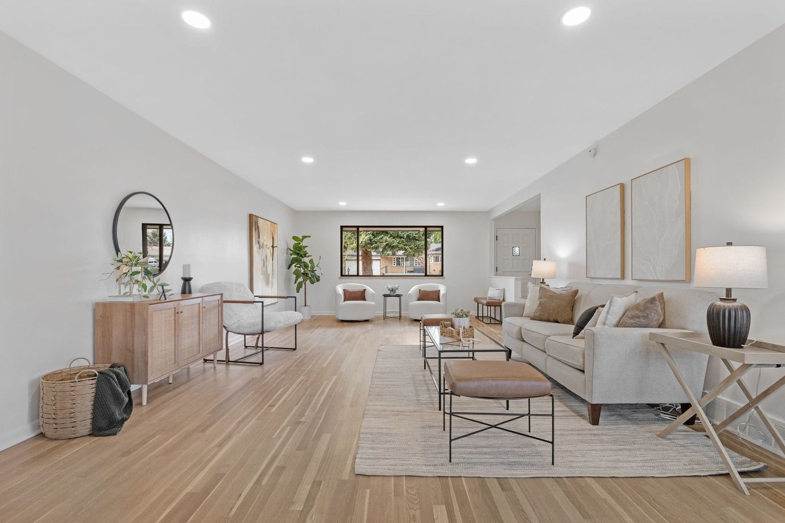 Bright, lightly staged living room in a Denver home that shows well